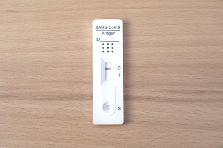 Negative Sars-CoV-2 test on a wooden table