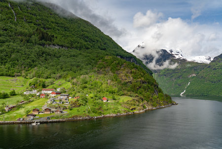 Beautiful landscape with houses in Geiranger fjord, Norwayの写真素材