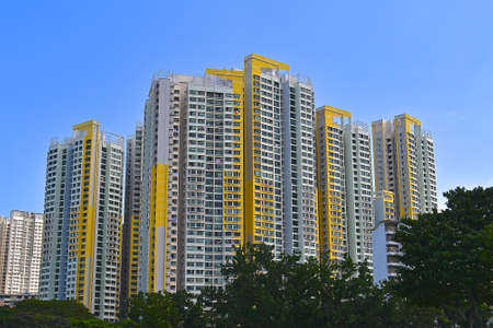 Yellow and white HDB apartment blocks in Singapore.のeditorial素材