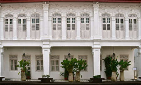 A row of restored white peranakan shophouses in the unesco world heritage town of George town, Penang.のeditorial素材