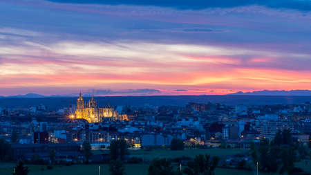 Panoramic photograph of the city of Leon, Spain. It is seen during the start of the blue hour with a spectacular sky and the illuminated Cathedralの写真素材
