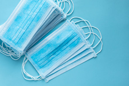 PPE, surgical masks, medical masks close up, on a blue background