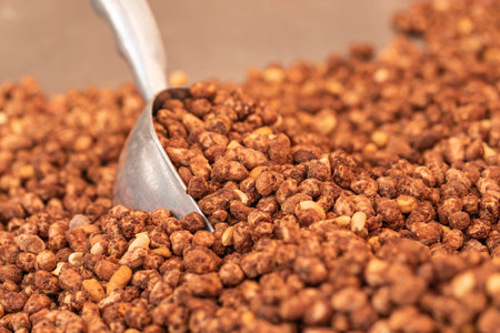 Sweet candied, sweet peanuts with sugar, close up. Selective focus. Out of focusの写真素材