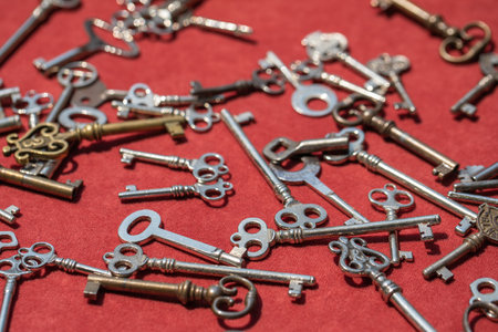 Old vintage keys on red background closeup, concept safetyの写真素材