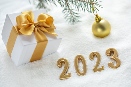 Happy New Year 2023 background, new year holidays card with gift box on the snow.