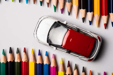 Toy car on road made with colored pencilsの写真素材