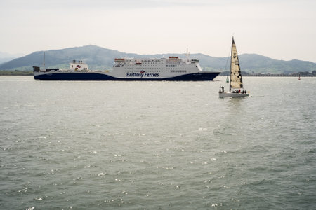 Santander, Spain; April 16th 2017: Ro ro and sailing ship in the bay.のeditorial素材