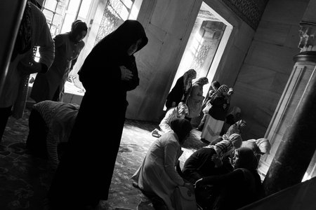 Istanbul, Turkey; May 25th 2013: Women praying at private zone in Blue Mosque.