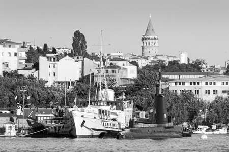 Istanbul, Turkey; May 26th 2013: Ship and submarine exhibited in the transport museum, with the Galata Tower in the background.のeditorial素材