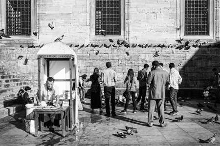 Istanbul, Turkey; May 27th 2013: People feeding pigeons.のeditorial素材