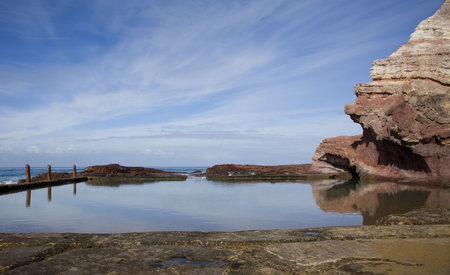 swimming pool carved out of rocksの写真素材