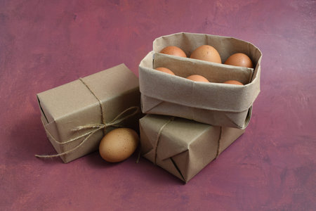 Eggs in a paper box on a rustic background.
