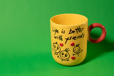 Yellow mug with an inscription. Friendship Day concept.の写真素材
