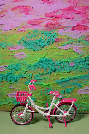 Pink bicycle on plasticine backgroundの写真素材