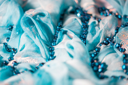 Texture, background, pattern, silk fabric, turquoise with a pattern of sequins, beadsの写真素材
