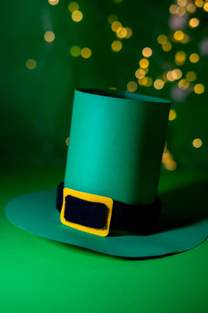 Green leprechaun hat on green background with bokehの写真素材