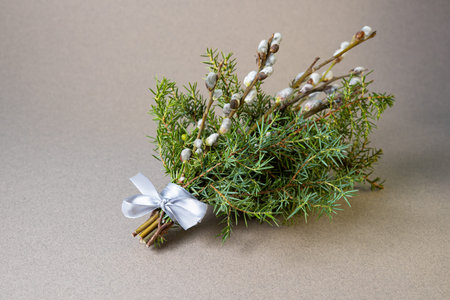 Decorative bouquet featuring willow branches and evergreen twigs, symbolizing Palm Sunday traditions , used in religious ceremoniesの写真素材
