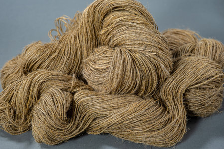 Linen yarn on gray background. Close up.の写真素材