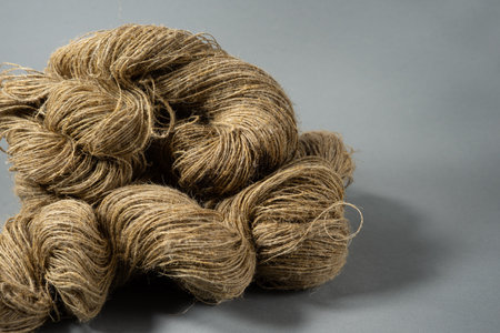 Linen yarn on gray background. Close up.の写真素材
