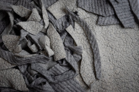 Crumpled gray woolen fabric texture background. Close up.