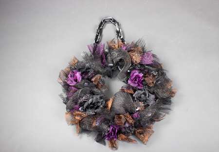 hand made halloween wreath crafted from black and spider web design meshの写真素材