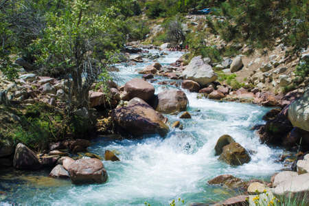 Wide shot landscape of mountains and a blue riverの写真素材