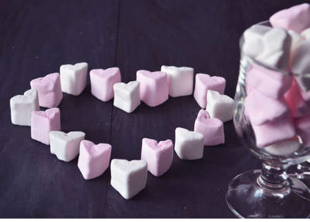 Marshmallow heart over pink background. Valentine's Day or Love conceptの写真素材
