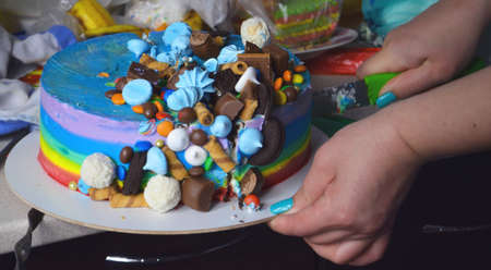 Milk chocolate cake. Brightly decorated in a cut. Cake for the birthday of the child. Blog food concept. Confectionery art. A piece of delicious cake. High cooking.の写真素材