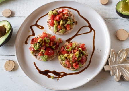 Salad with chopped avocados and tomatoes marinated with a balsamic dressing and served as a sandwich...