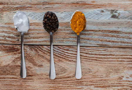 Golden paste or turmeric paste ingredients such as turmeric powder, coconut oil and black...