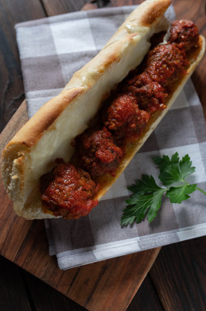 Italian meatball sandwich with tomato sauce and mozzarella cheese on baguetteの写真素材