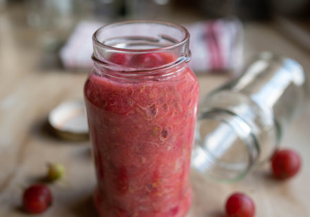 Gooseberry compote in a glass jarの写真素材