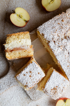 Apple cream torte with junkie apple sauce, whipped cream on wooden cutting board