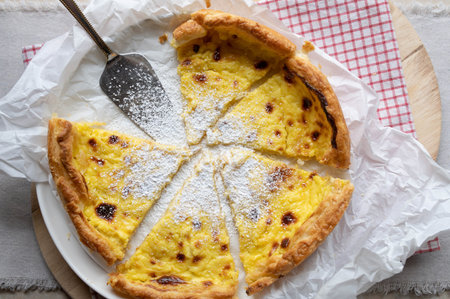 Puff pastry tart with sour cream, egg yolk, lemon, sugar fillingの写真素材