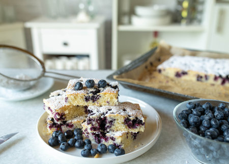 Blueberry cake on a white plate with blueberries, selective focusの写真素材