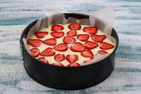 Preparation of curd pie with strawberries for baking