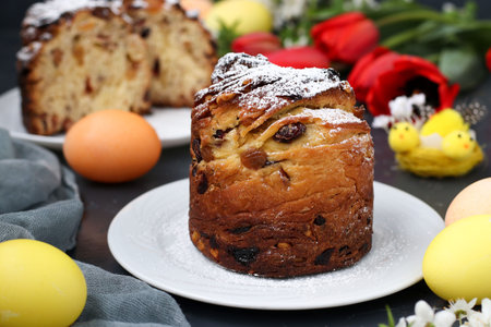 Easter cake Craffin and colorful eggs on a dark background, The concept of the spring church holiday