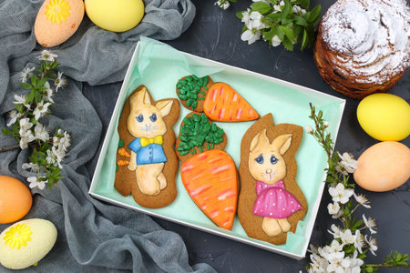 Easter gingerbread are located in a box on a dark background, top view, The concept of the spring...