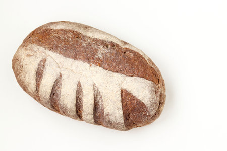 Bread made from whole grain flour located on a white background