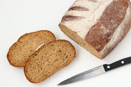 Sliced whole grain flour bread , located on a white background, top view