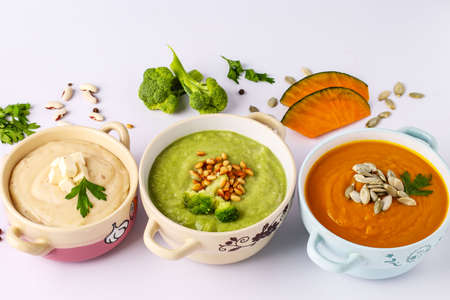 Variety of vegetables cream soups: with broccoli, white beans and pumpkins, ingredients for soup, healthy eating concept, Top view, Horizontal orientationの写真素材
