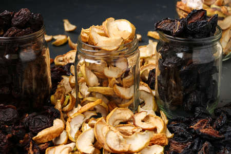 Homemade dried apples, plums and pears in glass jars, Horizontal orientation, Closeupの写真素材
