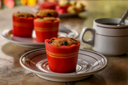 Sweet muffins, coffee and fruits - a traditional breakfast at a hotel on the island of Bali in...