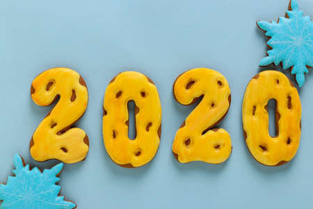 Gingerbread cookies in the form of numbers 2020, gifts christmas or Noel holiday, Happy New Year, blue background, horizontal orientationの写真素材