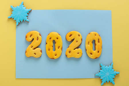 Gingerbread cookies in the form of numbers 2020, gifts christmas or Noel holiday, Happy New Year, blue background, horizontal orientationの写真素材