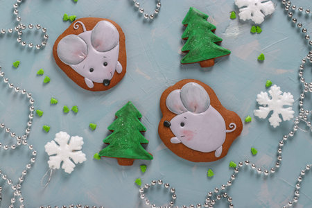 Gingerbread mouses and Christmas trees on a light blue background, gifts christmas or Noel holiday,...