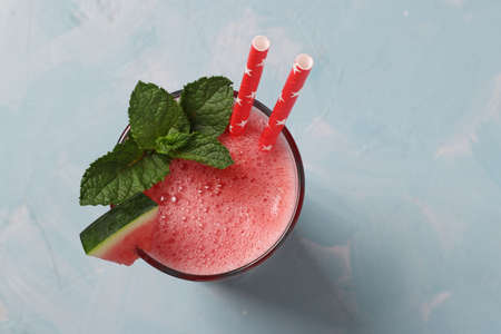 Watermelon cocktail with mint on blue background, top view, Closeupの写真素材