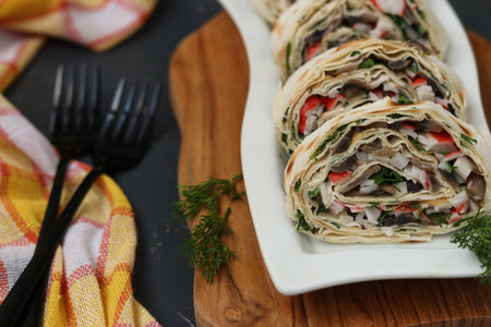 Lavash roll with champignons, crab sticks and cheese, festive appetizer, Closeup, Horizontal format