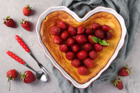 Heart-shaped curd casserole decorated with strawberries, close-up, View from aboveの写真素材