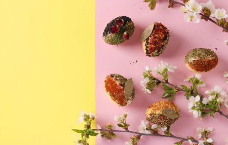 Easter concept with eggs decorated with different spices and cereals without dyes and preservatives...